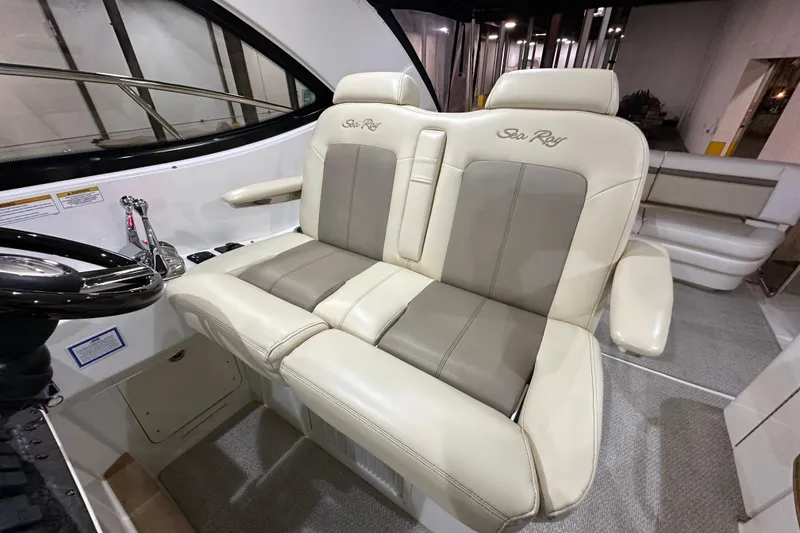 Slide: The Image of Luxurious seating on a 2014 Sea Ray 410 Sundancer yacht, featuring plush upholstery and elegant design. - 16