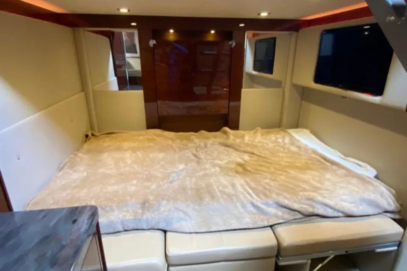 Slide: The Image of Luxurious interior cabin of 2014 Sea Ray 410 Sundancer yacht with cozy bedding. - 27
