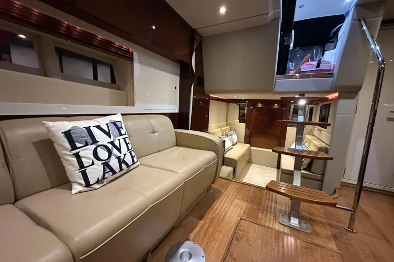 Slide: The Image of Luxurious interior of 2014 Sea Ray 410 Sundancer yacht with beige leather seating. - 24
