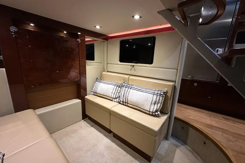 Slide: The Image of Luxurious interior of 2014 Sea Ray 410 Sundancer yacht with beige seating and modern decor. - 26