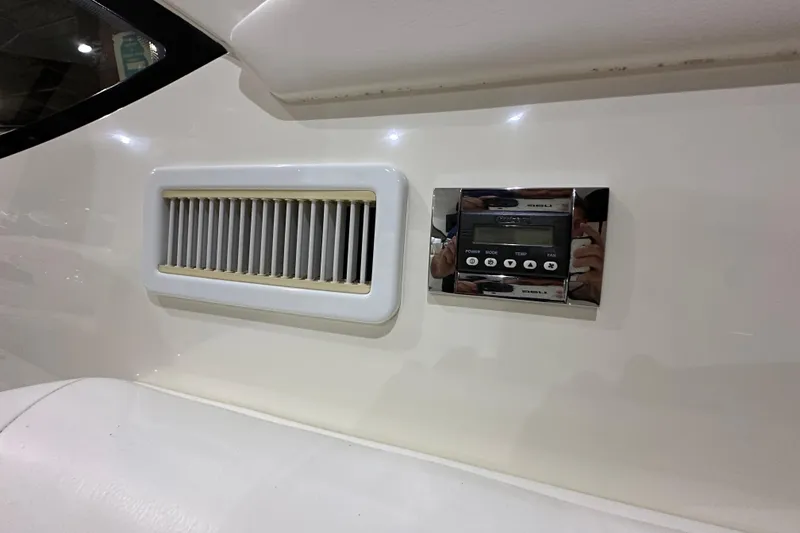 Slide: The Image of Control panel and vent on a 2014 Sea Ray 410 Sundancer yacht interior. - 19
