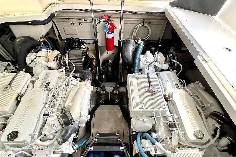Slide: The Image of Engine room of a 2014 Sea Ray 410 Sundancer with dual engines and fire extinguisher. - 37