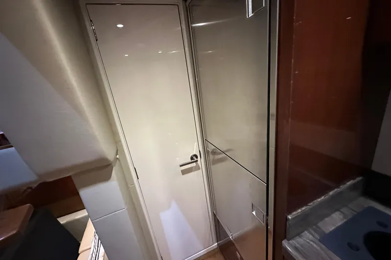 Slide: The Image of Interior of 2014 Sea Ray 410 Sundancer yacht, featuring sleek cabinetry and modern design. - 34