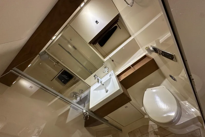 Slide: The Image of Luxurious bathroom interior of 2014 Sea Ray 410 Sundancer yacht, featuring modern fixtures. - 32