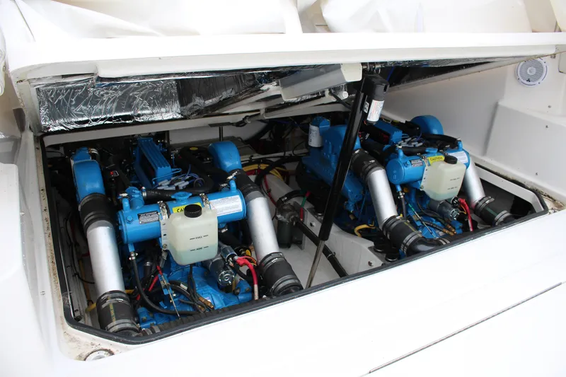 Slide: The Image of Engine compartment of a 2001 Tiara Yachts 2900 Coronet, showcasing dual blue engines. - 39