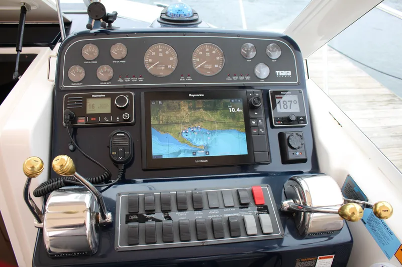 Slide: The Image of Dashboard of a 2001 Tiara Yachts 2900 Coronet with navigation and control instruments. - 24