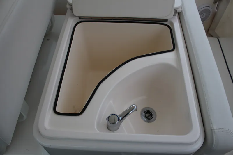 Slide: The Image of Tiara Yachts 2900 Coronet 2001 sink with faucet and drain in boat interior. - 30