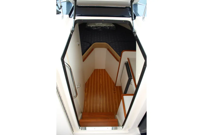 Slide: The Image of Interior view of 2001 Tiara Yachts 2900 Coronet cabin with wooden flooring. - 15