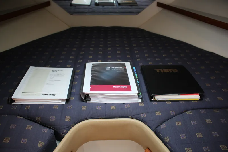 Slide: The Image of Manuals on a Tiara Yachts 2900 Coronet 2001 cabin bed. - 20