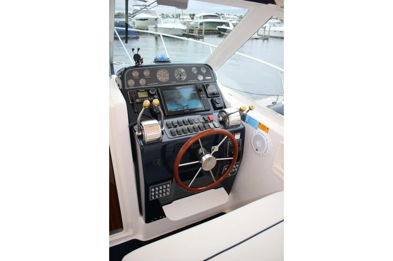 Slide: The Image of Helm of 2001 Tiara Yachts 2900 Coronet with steering wheel and control panel. - 25