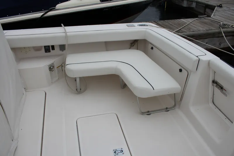 Slide: The Image of 2001 Tiara Yachts 2900 Coronet interior with white seating and deck details. - 33