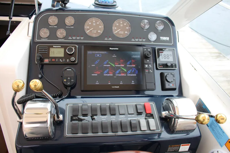 Slide: The Image of Control panel of a 2001 Tiara Yachts 2900 Coronet with navigation and engine gauges. - 23