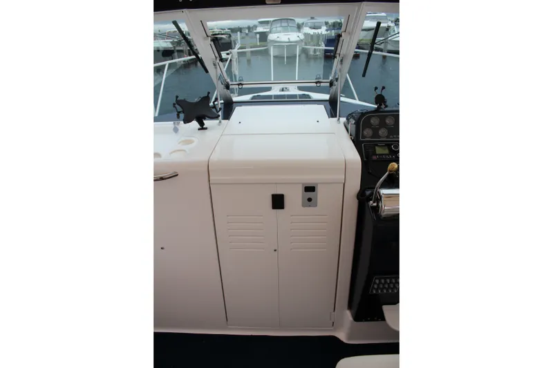 Slide: The Image of 2001 Tiara Yachts 2900 Coronet helm station with marina view. - 13