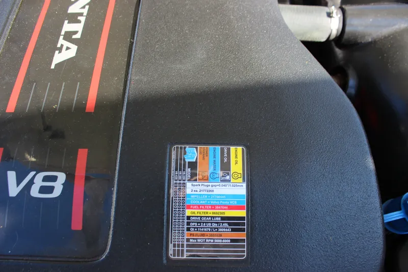 Slide: The Image of Engine cover of a 2016 Cobalt R5 WSS with V8 label and maintenance chart. - 42