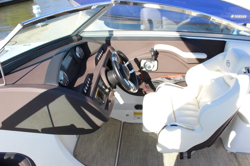 Slide: The Image of Interior of a 2016 Cobalt R5 WSS boat, featuring a sleek dashboard and comfortable seating. - 24