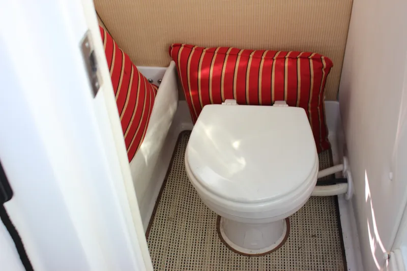 Slide: The Image of Compact boat bathroom with toilet and striped cushions, 2016 Cobalt R5 WSS model. - 49