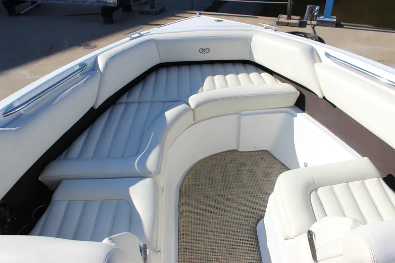 Slide: The Image of Luxurious seating area on a 2016 Cobalt R5 WSS boat, featuring white upholstery. - 56