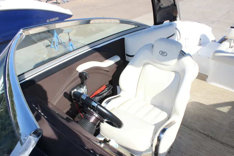 Slide: The Image of 2016 Cobalt R5 WSS boat interior with white captain's seat and steering wheel. - 18