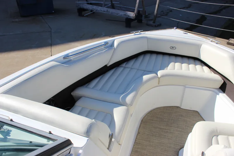 Slide: The Image of 2016 Cobalt R5 WSS boat interior with white cushioned seating and carpeted floor. - 50