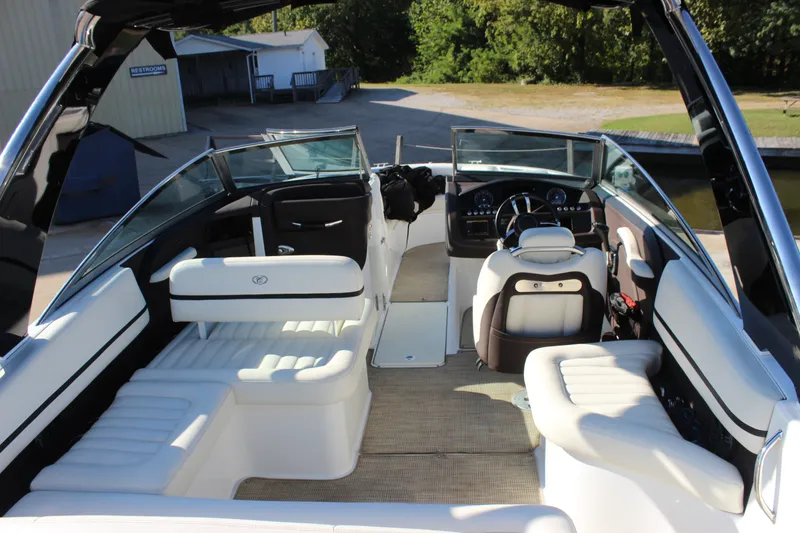 Slide: The Image of 2016 Cobalt R5 WSS boat interior with white seating and modern dashboard. - 12