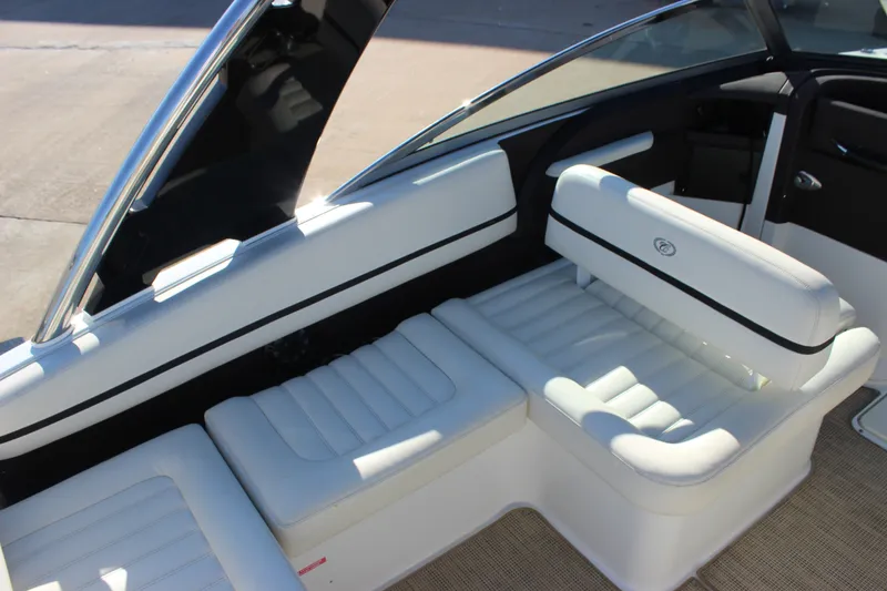 Slide: The Image of 2016 Cobalt R5 WSS boat interior with white cushioned seating and sleek design. - 47