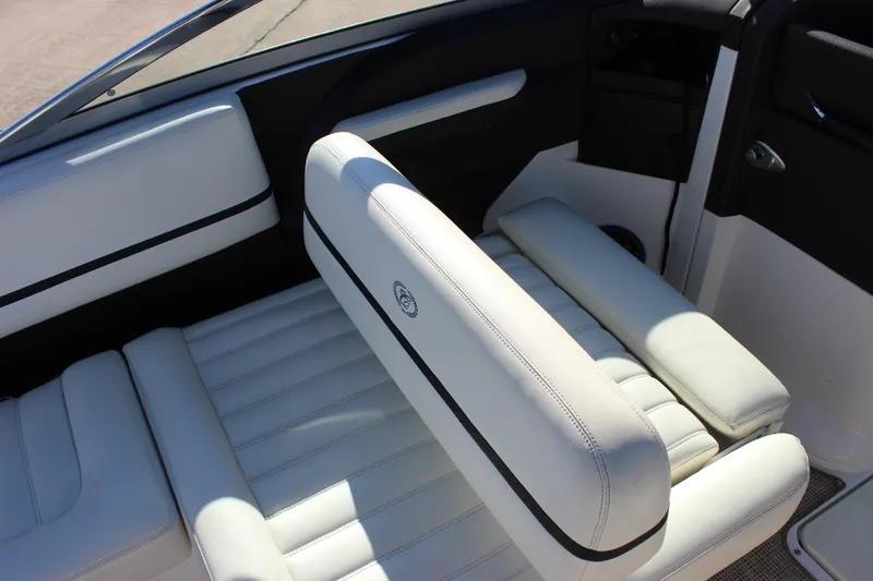 Slide: The Image of 2016 Cobalt R5 WSS boat interior with white leather seating and black accents. - 52