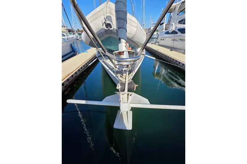 Slide: The Image of Front view of a 1970 Newport 41 sailboat docked in a marina. - 20