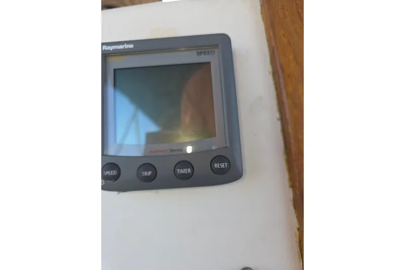 Slide: The Image of Raymarine speed display on 1970 Newport 41 sailboat, featuring speed, trip, timer, and reset buttons. - 15