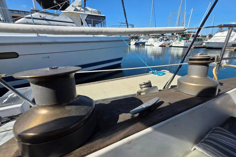 Slide: The Image of Sailboat deck view with winches, Newport 41, 1970 model, docked in marina. - 16