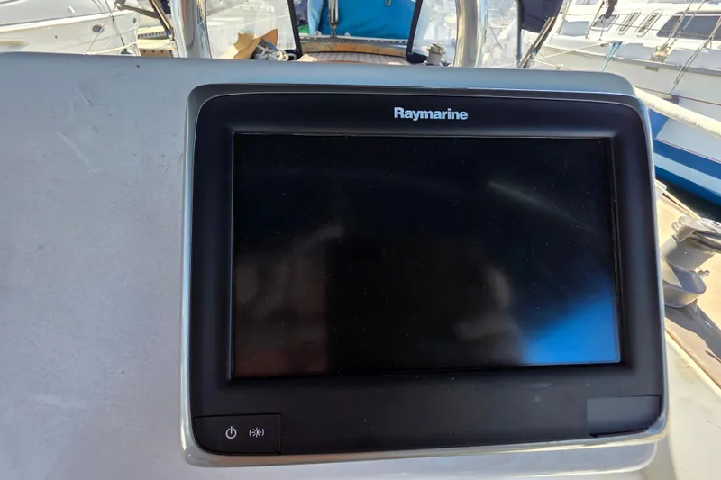Slide: The Image of Raymarine navigation display on a 1970 Newport 41 sailboat dashboard. - 13