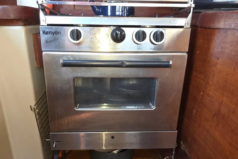 Slide: The Image of Stainless steel Kenyon stove in a 1970 Newport 41 yacht kitchen. - 3