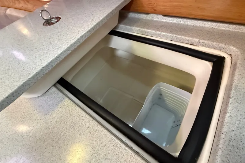 Slide: The Image of Built-in cooler compartment on 2007 Catalina 34 MkII yacht, featuring a sleek countertop design. - 60