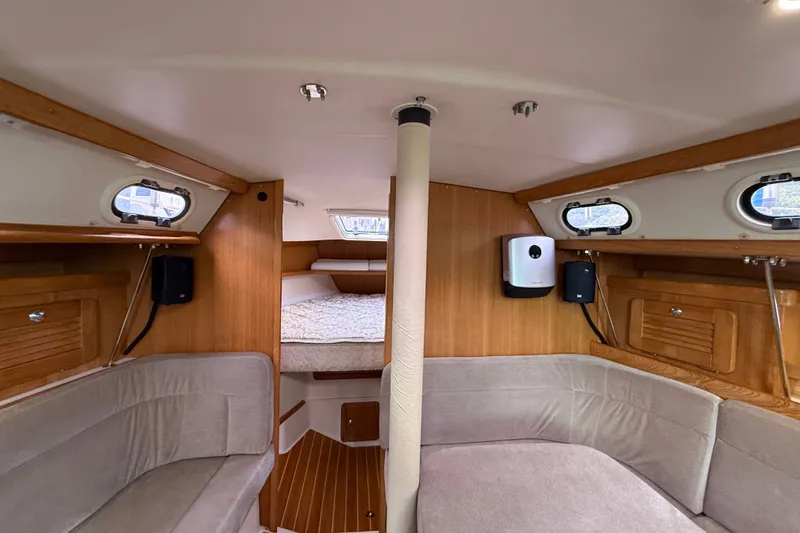 Slide: The Image of Interior of 2007 Catalina 34 MkII sailboat with cozy seating and wood accents. - 57