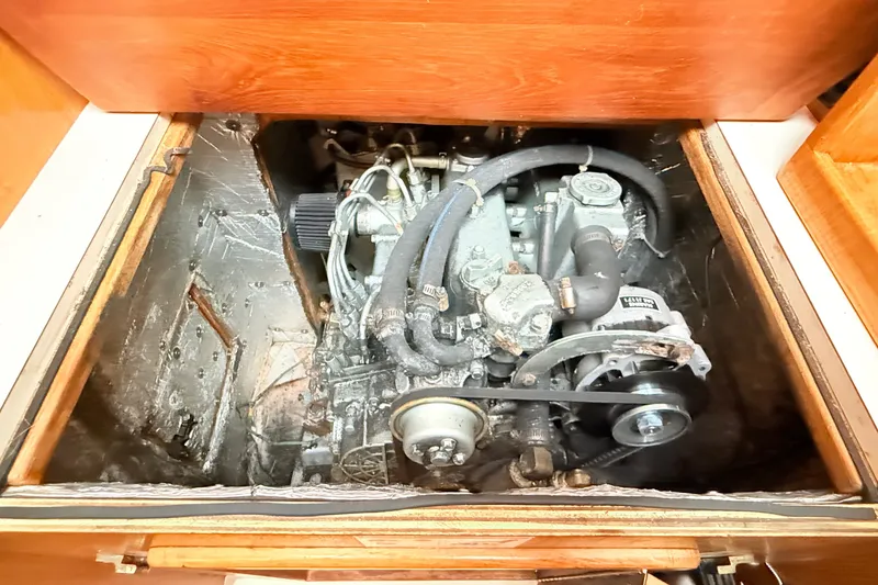 Slide: The Image of Engine compartment of a 2007 Catalina 34 MkII sailboat, showcasing mechanical components. - 71