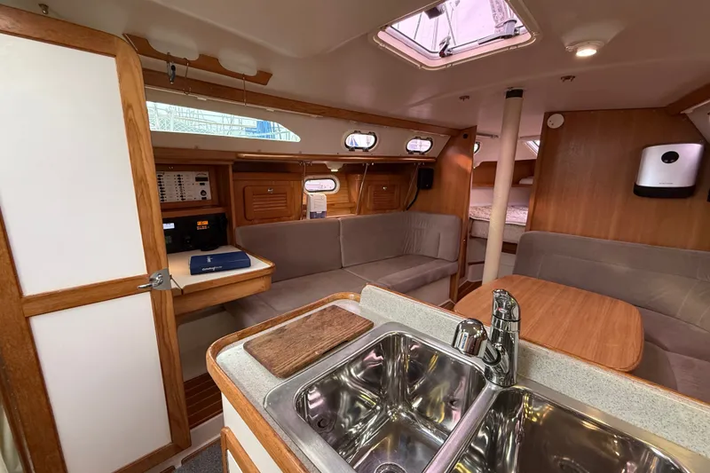 Slide: The Image of Interior of a 2007 Catalina 34 MkII sailboat with cozy seating and modern amenities. - 48