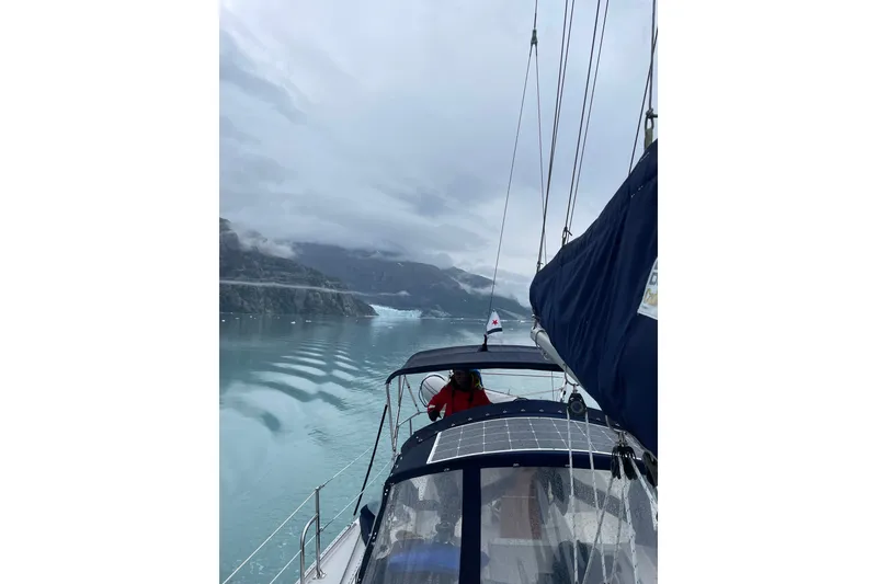 Slide: The Image of Sailing a 2007 Catalina 34 MkII through serene, icy waters under a cloudy sky. - 8
