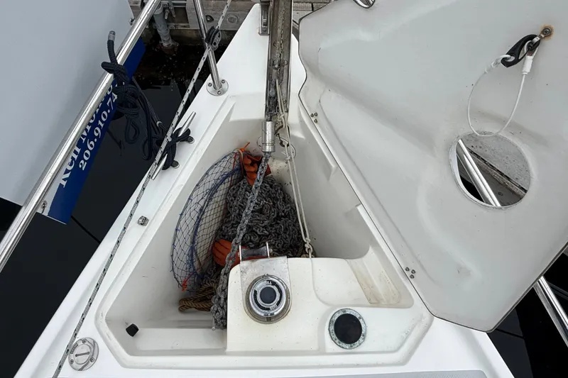Slide: The Image of Anchor locker of a 2007 Catalina 34 MkII sailboat with chain and rope. - 23