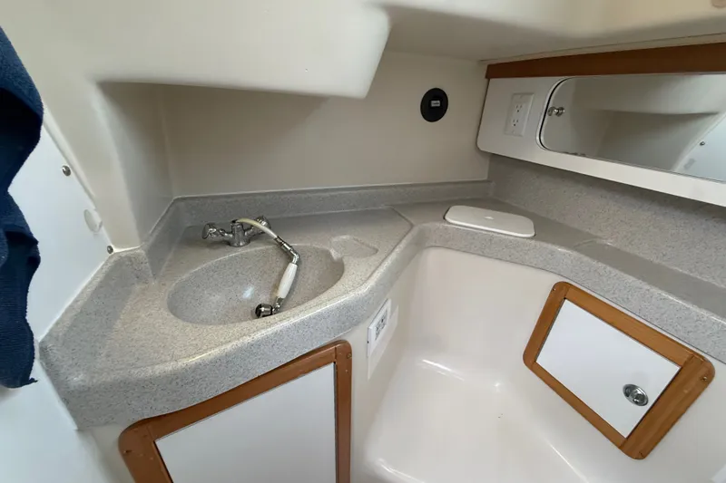Slide: The Image of 2007 Catalina 34 MkII bathroom with sink, mirror, and storage cabinets. - 65