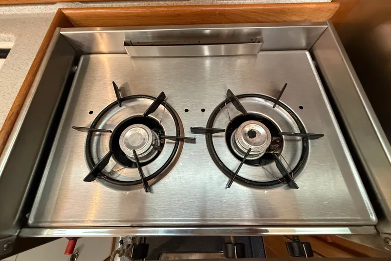 Slide: The Image of Stainless steel two-burner stove in a 2007 Catalina 34 MkII yacht kitchen. - 62