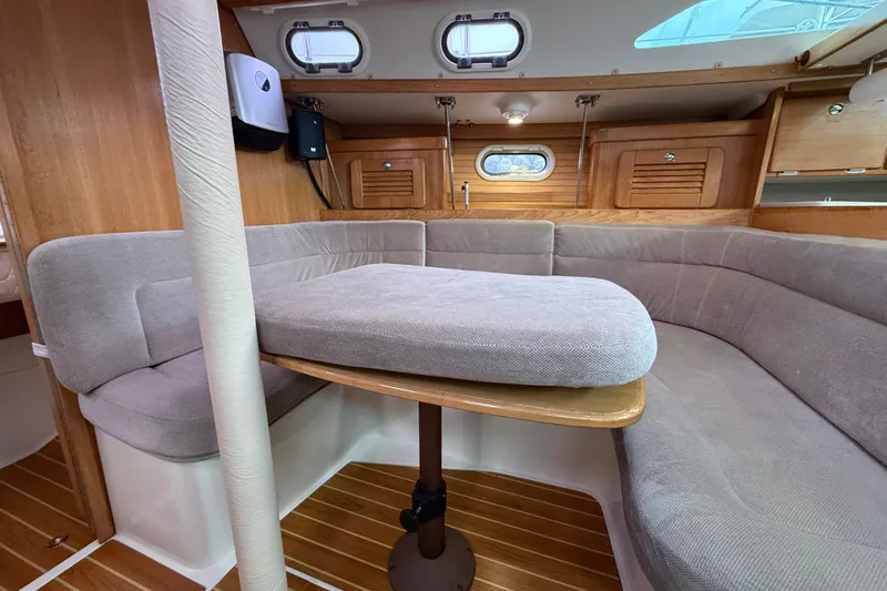 Slide: The Image of Interior of a 2007 Catalina 34 MkII sailboat with cozy seating and wooden accents. - 56