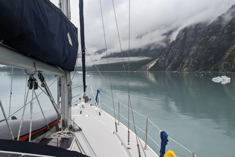 Slide: The Image of Sailing on a 2007 Catalina 34 MkII in a serene, icy fjord with misty mountains. - 9