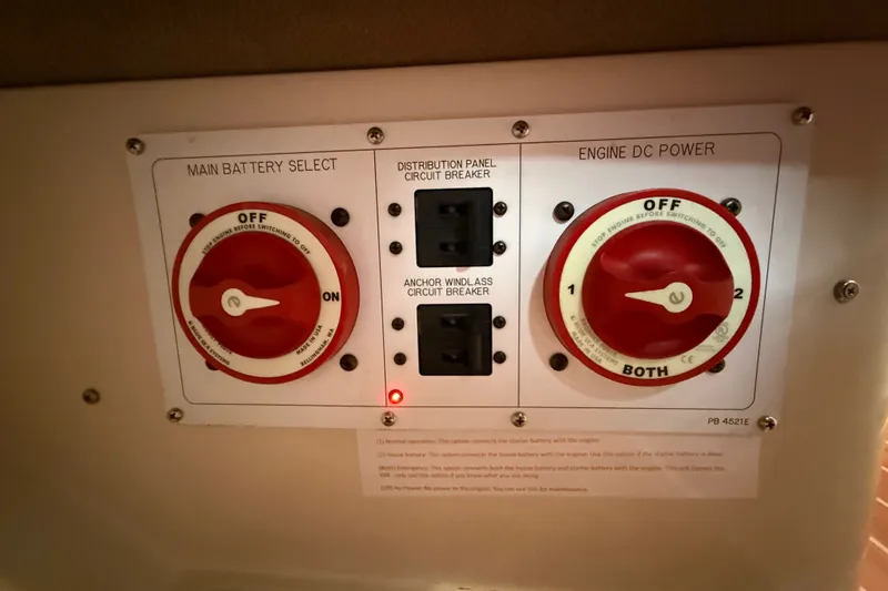 Slide: The Image of Control panel of a 2007 Catalina 34 MkII sailboat with battery selectors and circuit breakers. - 53