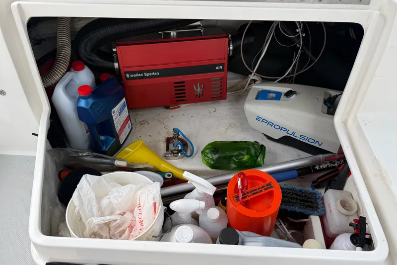 Slide: The Image of Storage compartment of a 2007 Catalina 34 MkII sailboat with various maintenance supplies. - 38