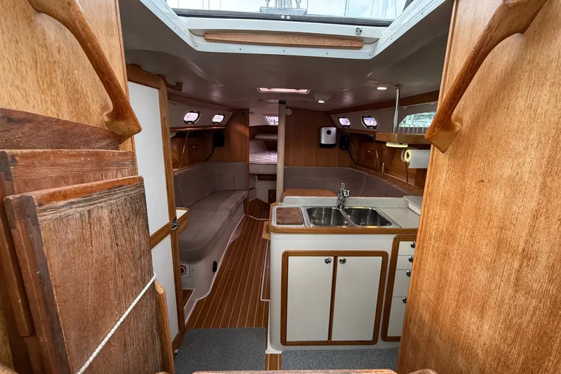 Slide: The Image of Interior of 2007 Catalina 34 MkII sailboat with wood finish and compact kitchen. - 46