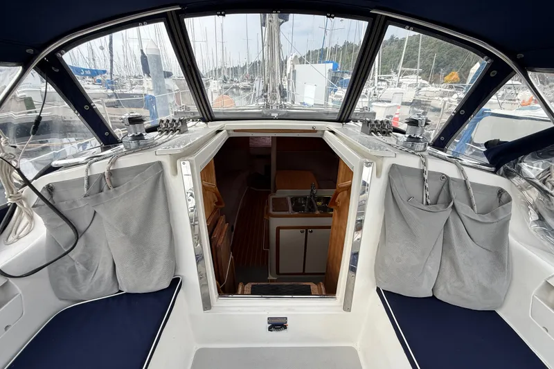 Slide: The Image of Interior view of a 2007 Catalina 34 MkII sailboat cockpit and cabin entrance. - 45