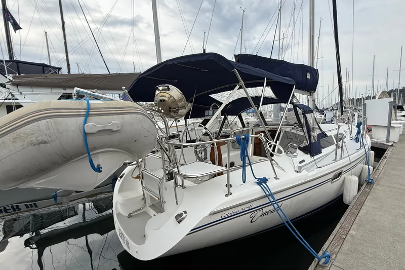 Slide: The Image of 2007 Catalina 34 MkII sailboat docked with inflatable dinghy attached. - 28