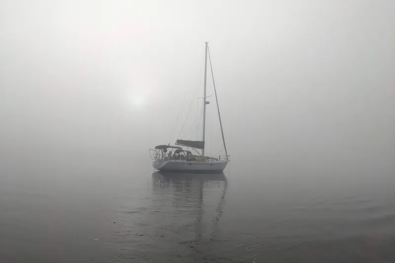 Slide: The Image of Sailboat Catalina 34 MkII 2007 in foggy waters, creating a serene atmosphere. - 7