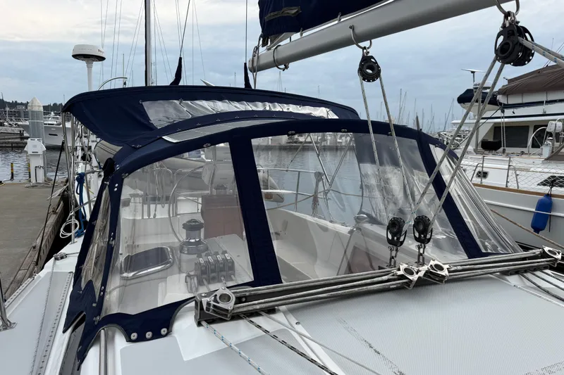 Slide: The Image of 2007 Catalina 34 MkII sailboat docked at marina with blue canvas covers. - 27