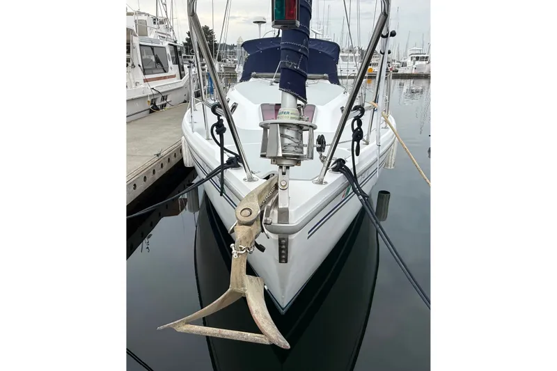 Slide: The Image of 2007 Catalina 34 MkII sailboat docked with anchor visible. - 15