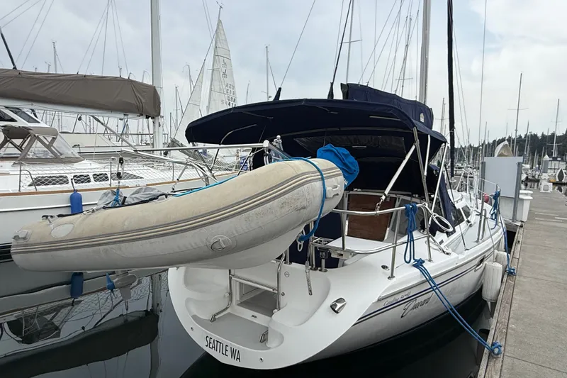 Slide: The Image of Catalina 34 MkII 2007 sailboat docked with inflatable dinghy, Seattle marina. - 18